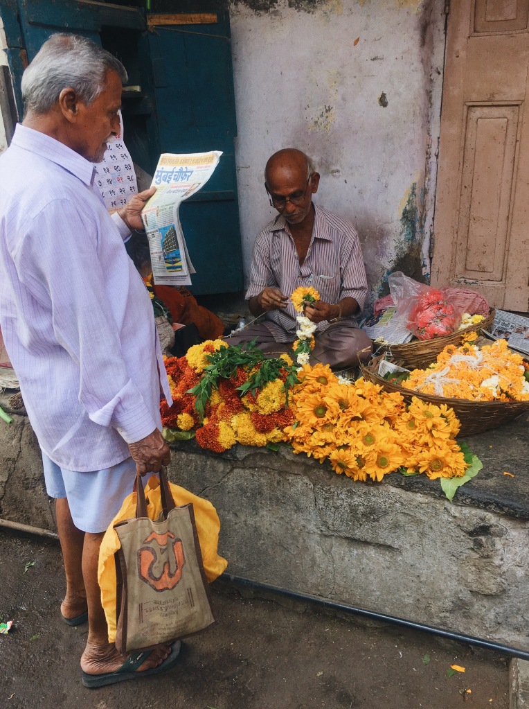 A Man Reading a Newspaper & a Florist Working in Mumbai's Worli Village Locality